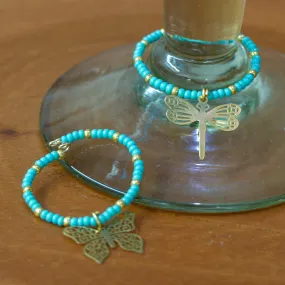 Set of 2 Handmade Beaded Drink Markers with Golden Pendants - Turquoise Flutter | NOVICA